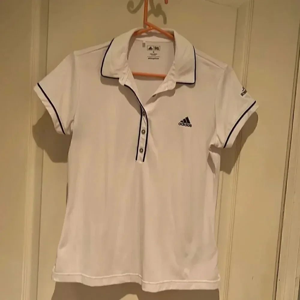Adidas ladies golf shirt with local golf club logo. Size medium